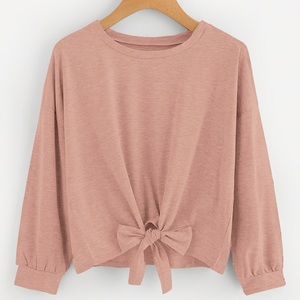 Self tie light pink sweater.